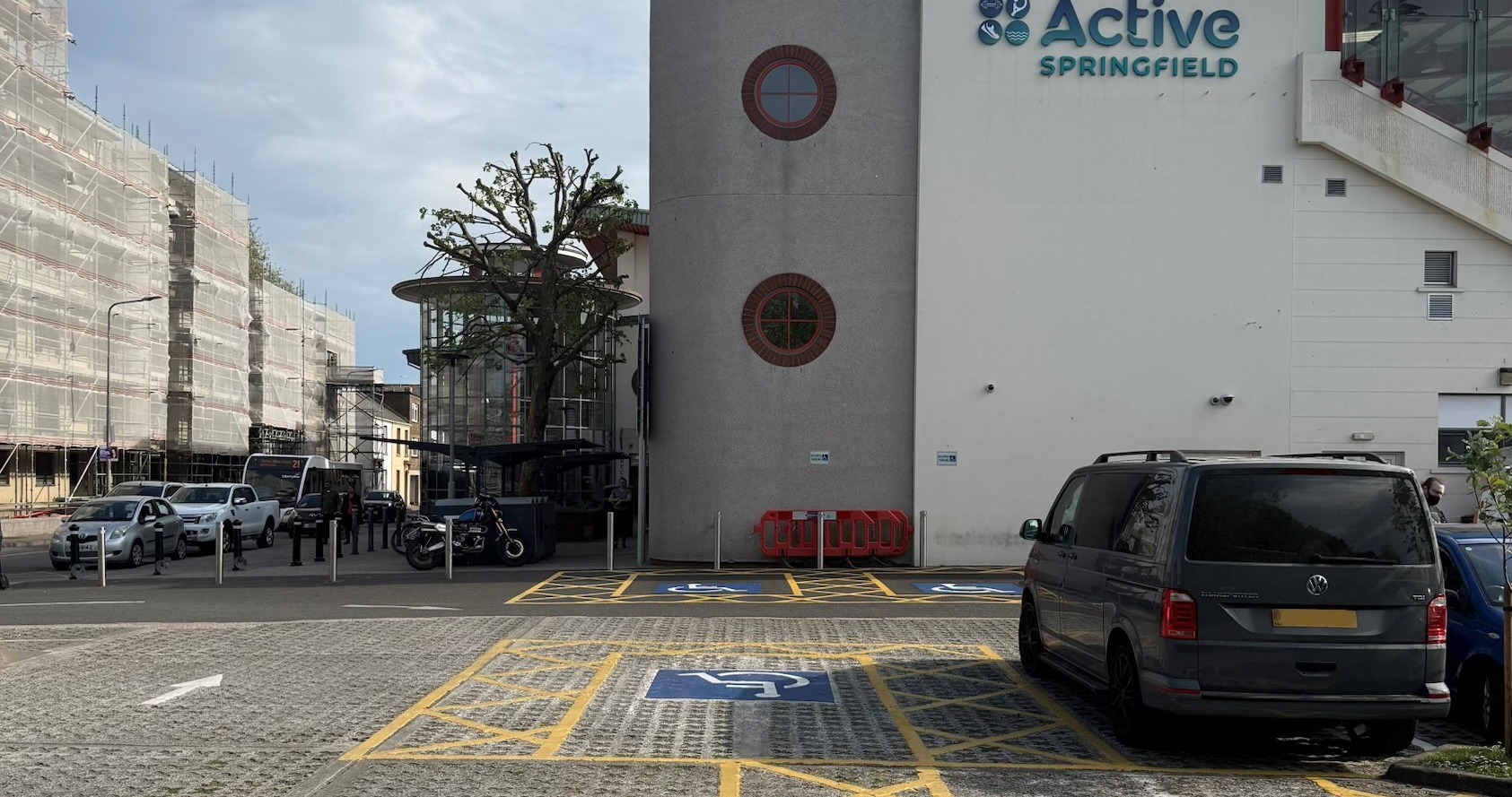 Exterior of the building showing accessible car parking spaces at Springfield stadium.