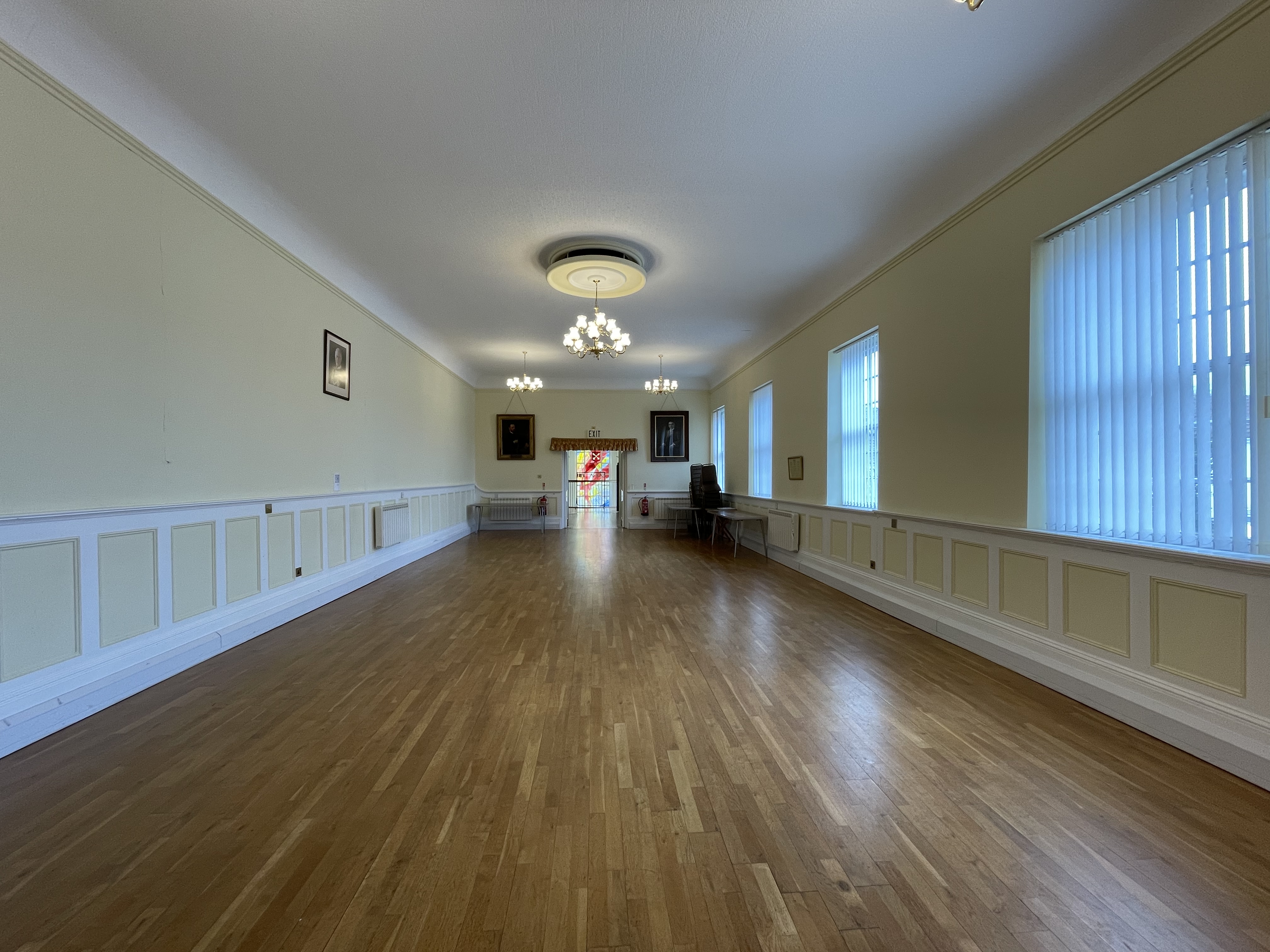 Internal view of Polling Room, showing a large room with wooden flooring.