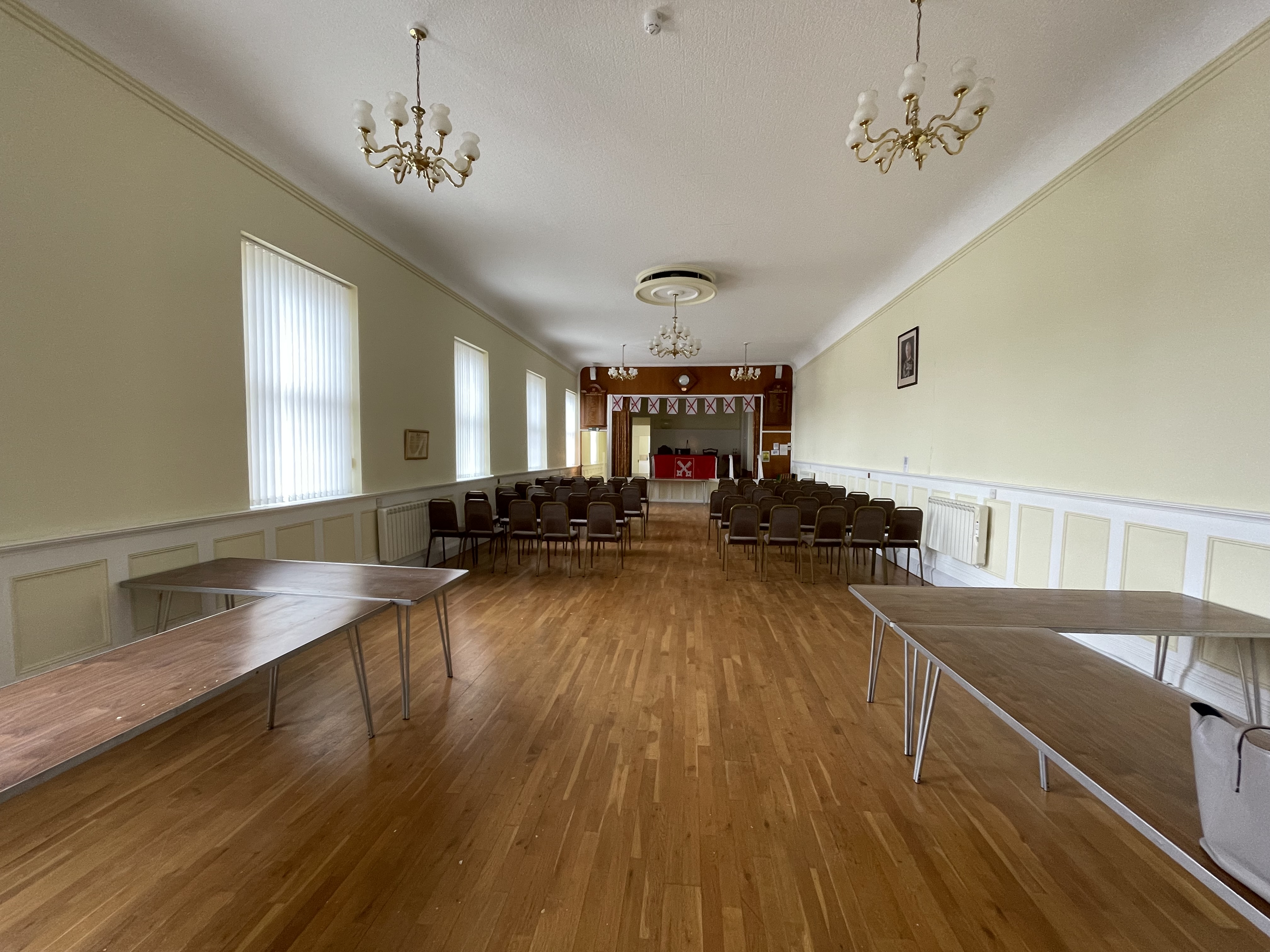Internal view of Polling Room, showing a large room with wooden flooring.