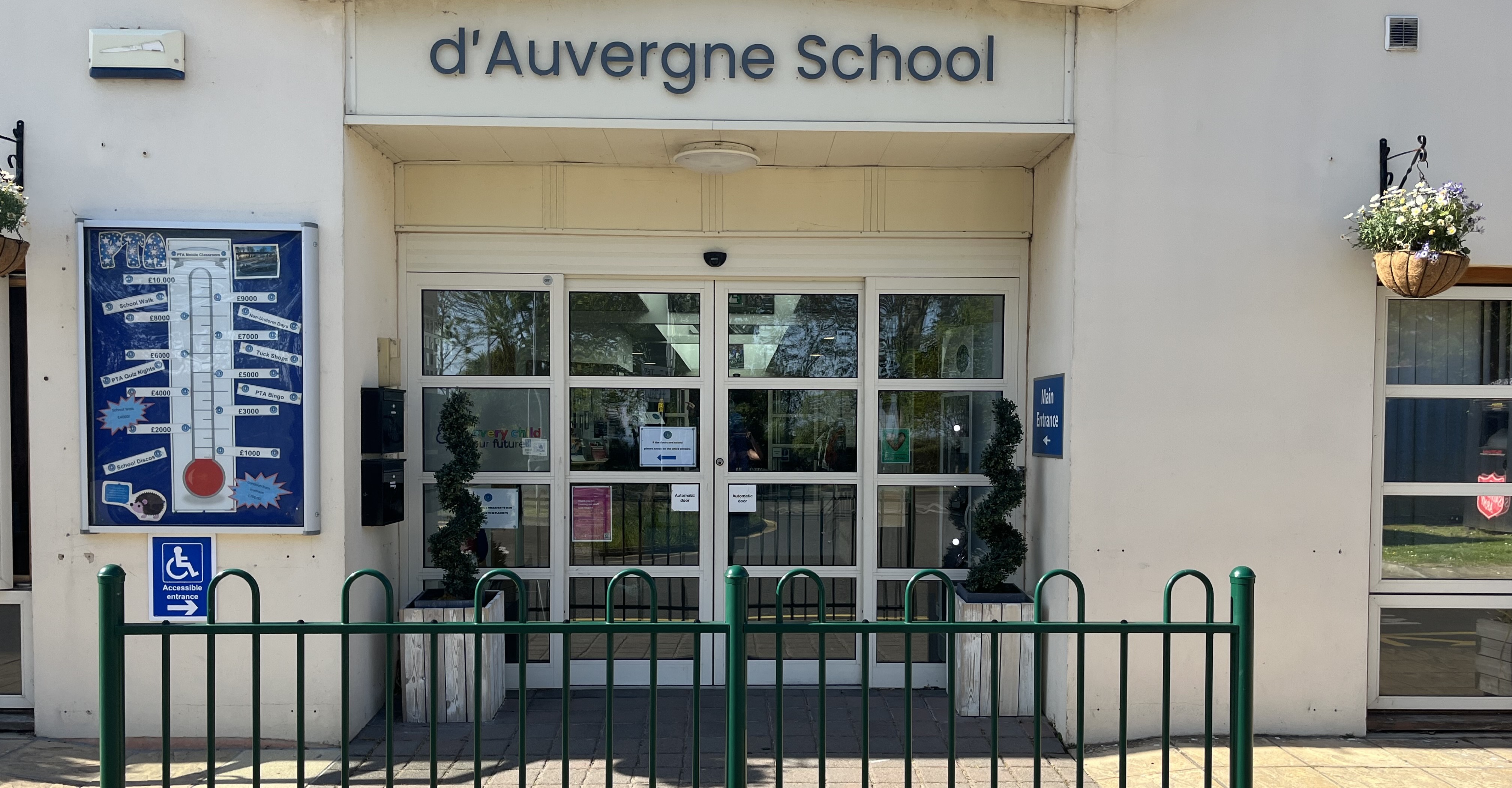 Main entrance doors to d'Auvergne School with railings in foreground
