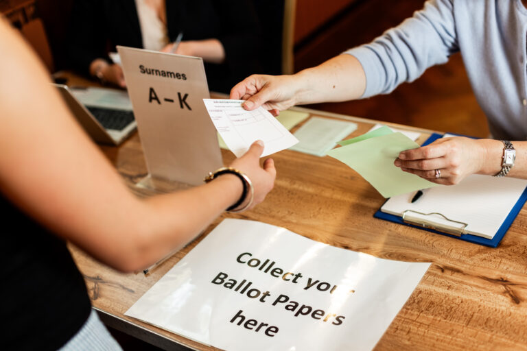 Voter being handed ballot