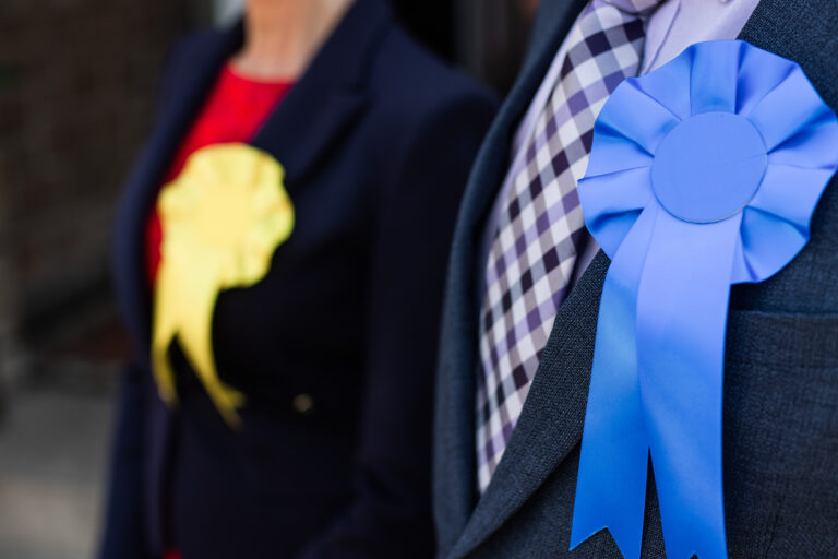 Two candidates rosettes