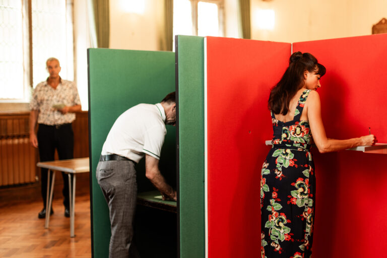 Voters writing ballots