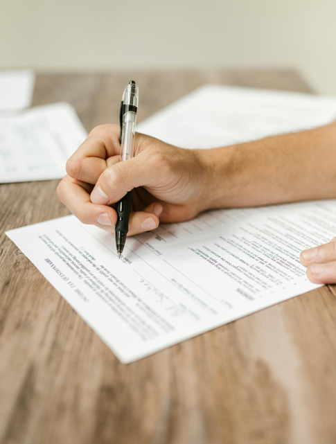 Person filling out a form