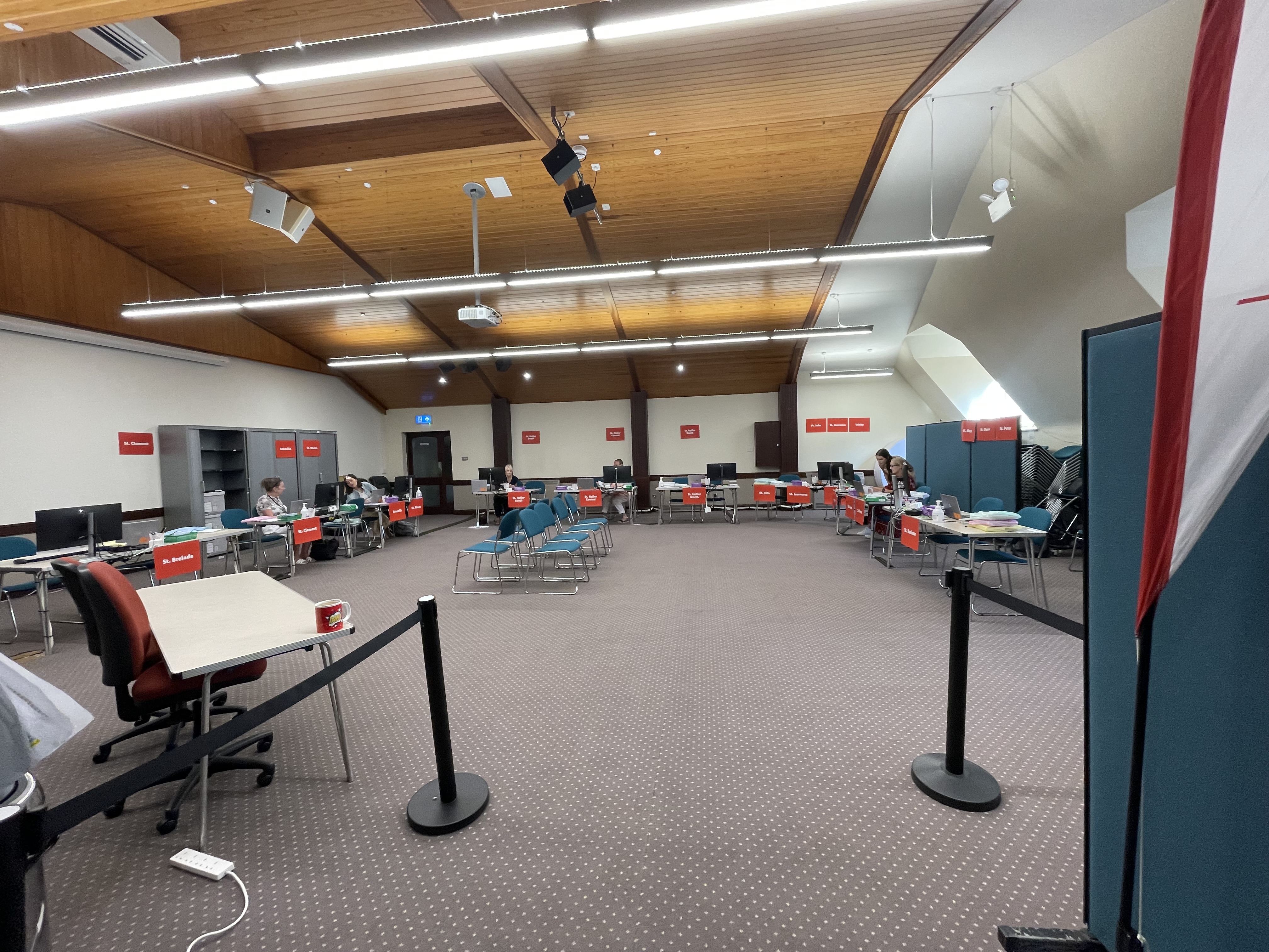 St. Paul's Centre Main Hall set up as a polling station with desks around the sides of the room and seating in the middle